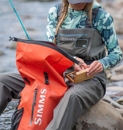 SIMMS DRY CREEK ROLL TOP BAG IN USE