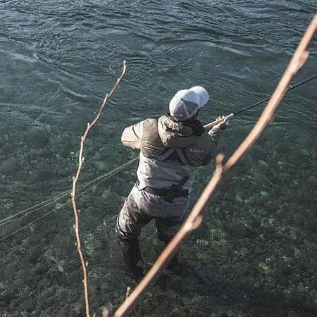 Fly angler wading in a river