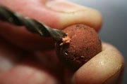 Bottom Bait into a Pop Up - Slowly drill into the centre of the boilie