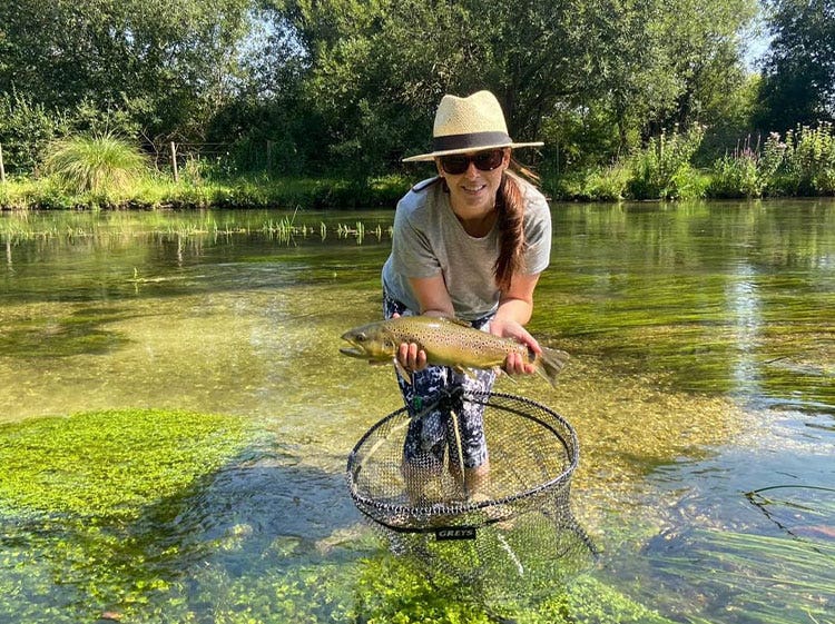 World Rivers Day, Lucy with a Brown Trout World Rivers Day, Lucy with a Brown Trout