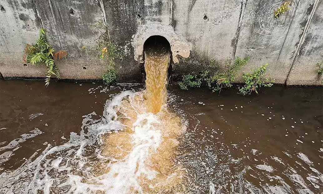 Raw sewage flowing into a river