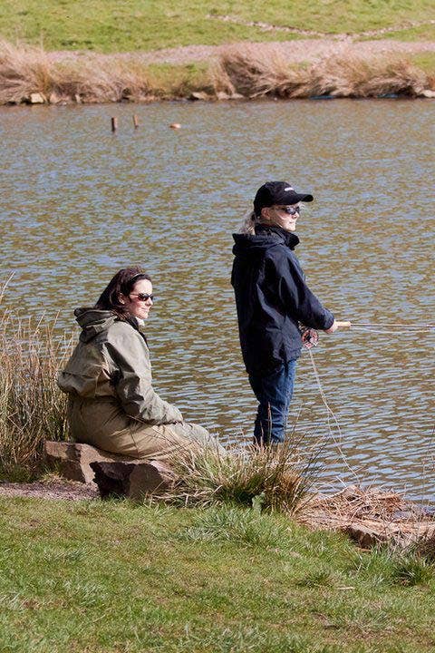 Lucy Coaching Young Angler Ruby