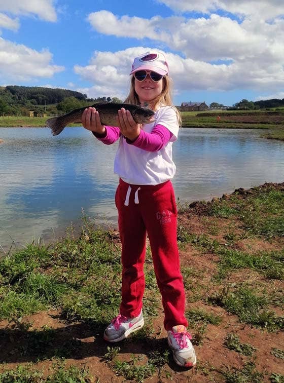 8 year old Maia with her first ever trout