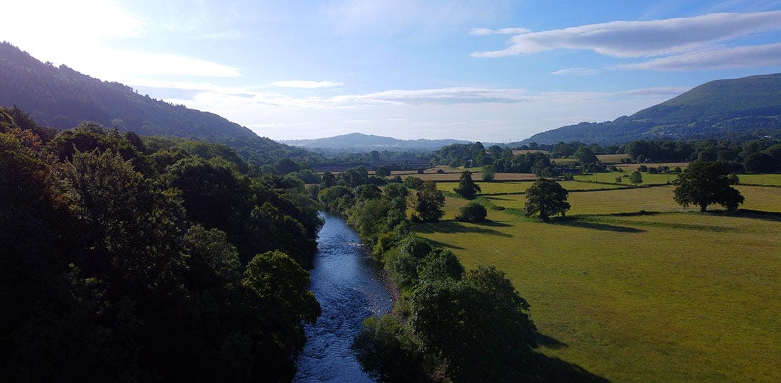 The stunning River Usk The stunning River Usk with blue skies and forestry surrounding